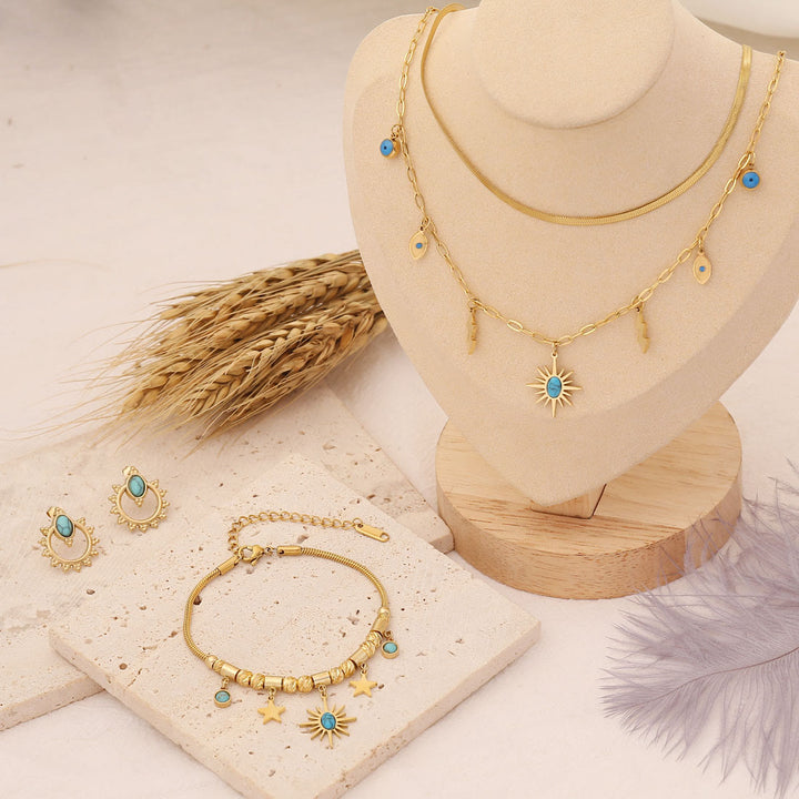 Collar, pulsera y pendientes con colgante de estrella y sol turquesa de Olivenorma