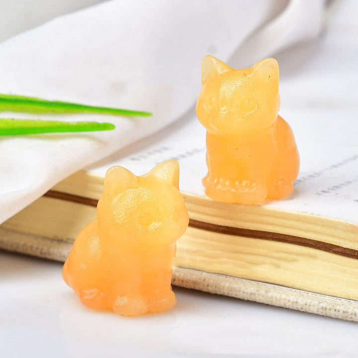 Artesanías con talladas de piedras preciosas y gatitos de cristal de Olivenorma.