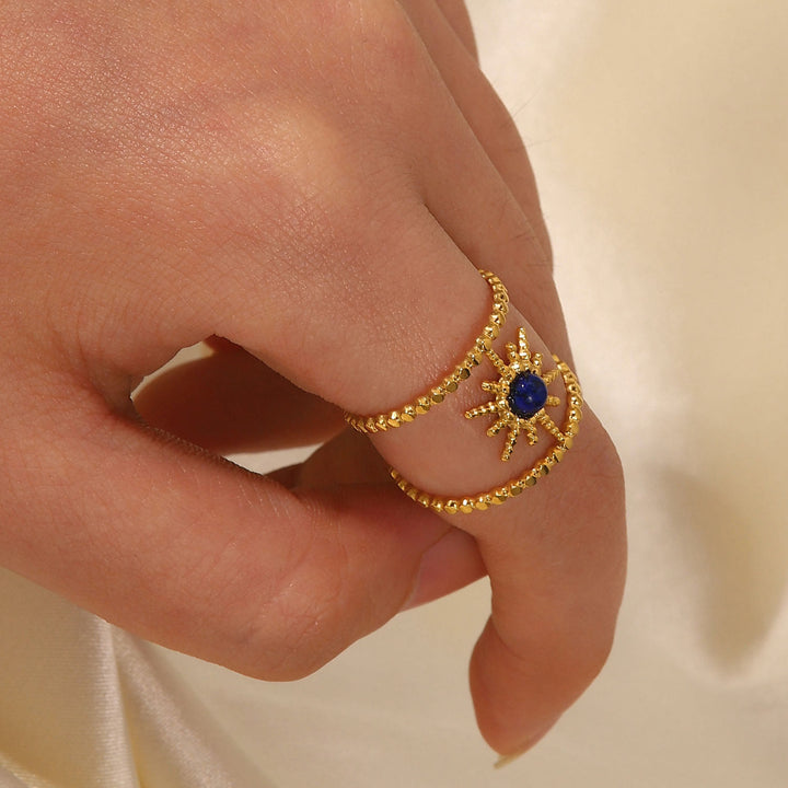Anillo de gemas con estrella de ocho puntas y doble hilera de girasol de Olivenorma
