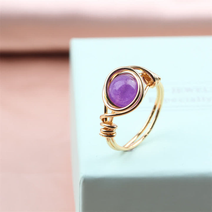 Anillo de cristal curativo envuelto en alambre