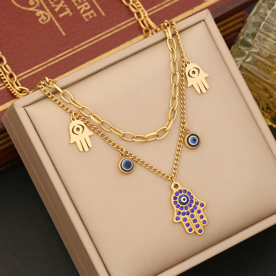 Conjunto de collar, pulsera y pendientes de resina epoxi con ojo de hamsa y mal de ojo de Olivenorma