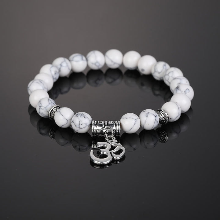 Pulsera con símbolo Om y cuentas de cristal natural de Olivenorma