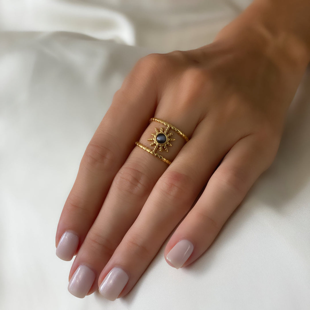 Anillo de gemas con estrella de ocho puntas y doble hilera de girasol de Olivenorma