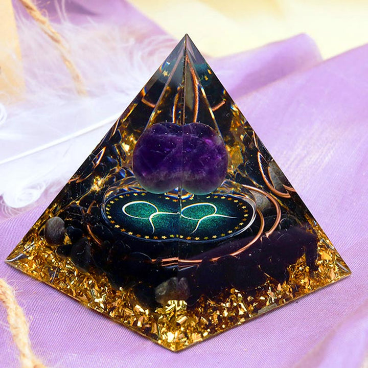 Pirámide de orgón del zodiaco Tauro con esfera de amatista y obsidiana de Olivenorma 
