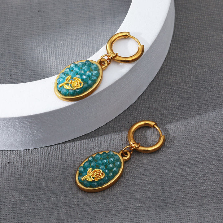 Pendientes colgantes ovalados con turmalina Paraiba y rosa triturada de Olivenorma