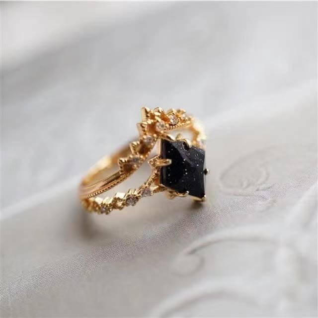 Anillo de corona de doble hilera de circonitas blancas y arenisca azul de Olivenorma