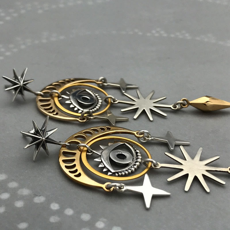 Pendientes de bruja con luna, estrella y ojo malvado de Olivenorma