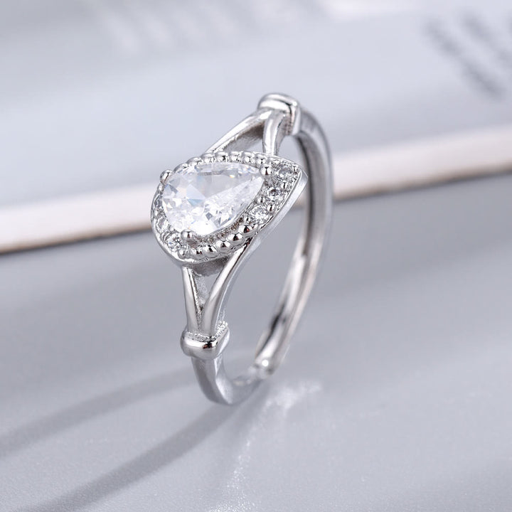 Anillo ajustable abierto con gota de agua y circonita blanca y amatista de Olivenorma