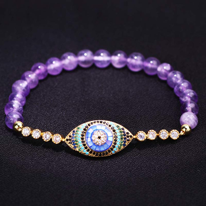 Pulsera curativa con símbolo del mal de ojo y amatista de Olivenorma 