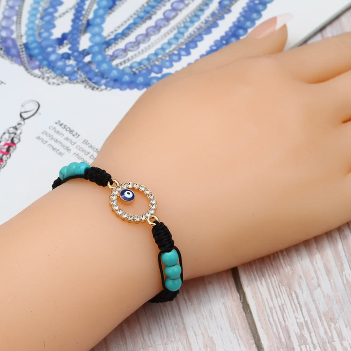 Pulsera trenzada ajustable con ojo malvado y circonita blanca y turquesa de Olivenorma 