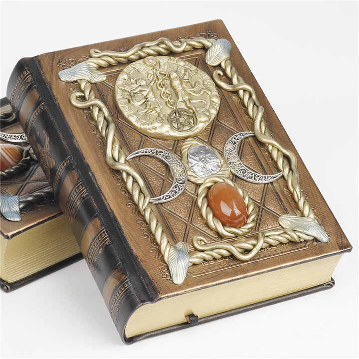 Cuaderno de notas con los signos del zodíaco de la luna, la estrella y el ágata roja de Olivenorma