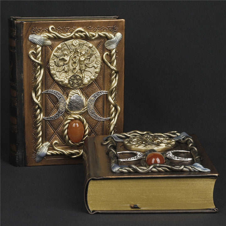 Cuaderno de notas con los signos del zodíaco de la luna, la estrella y el ágata roja de Olivenorma