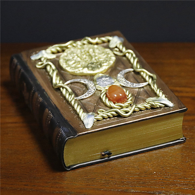 Cuaderno de notas con los signos del zodíaco de la luna, la estrella y el ágata roja de Olivenorma