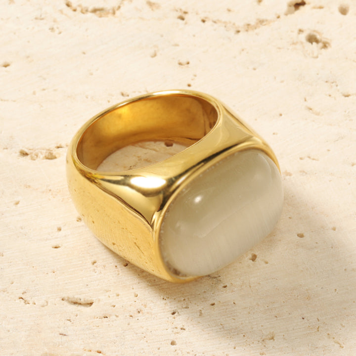 Anillo de acero y titanio con piedra de ojo de gato ovalada y turquesa de Olivenorma