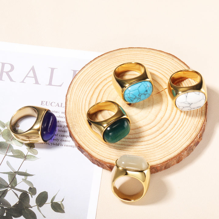 Anillo de acero y titanio con piedra de ojo de gato ovalada y turquesa de Olivenorma