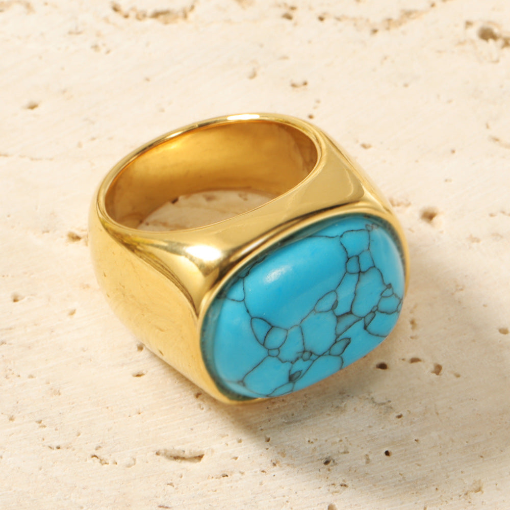 Anillo de acero y titanio con piedra de ojo de gato ovalada y turquesa de Olivenorma