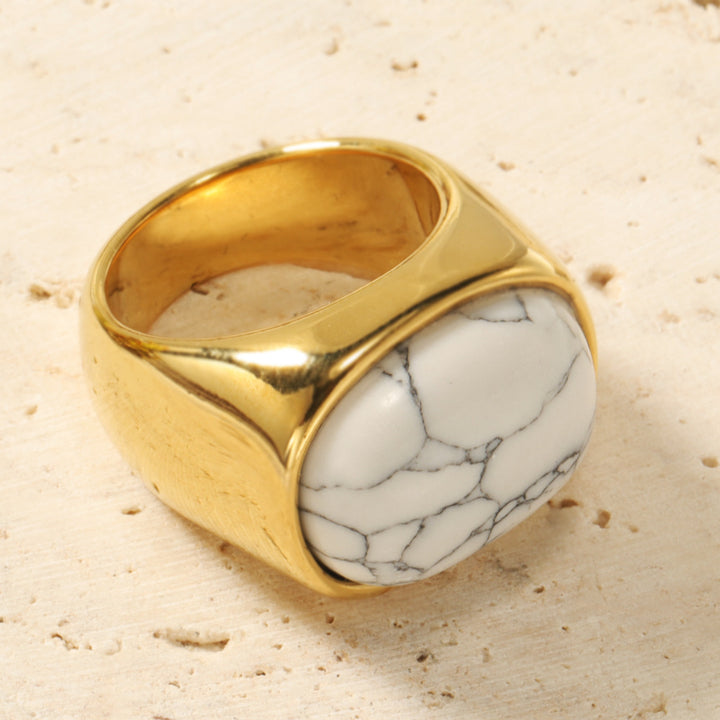 Anillo de acero y titanio con piedra de ojo de gato ovalada y turquesa de Olivenorma