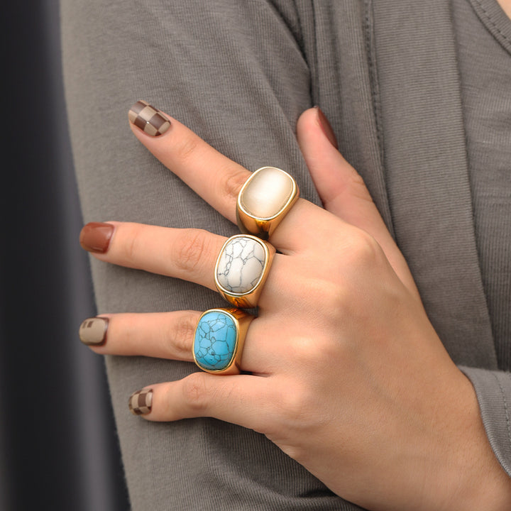 Anillo de acero y titanio con piedra de ojo de gato ovalada y turquesa de Olivenorma