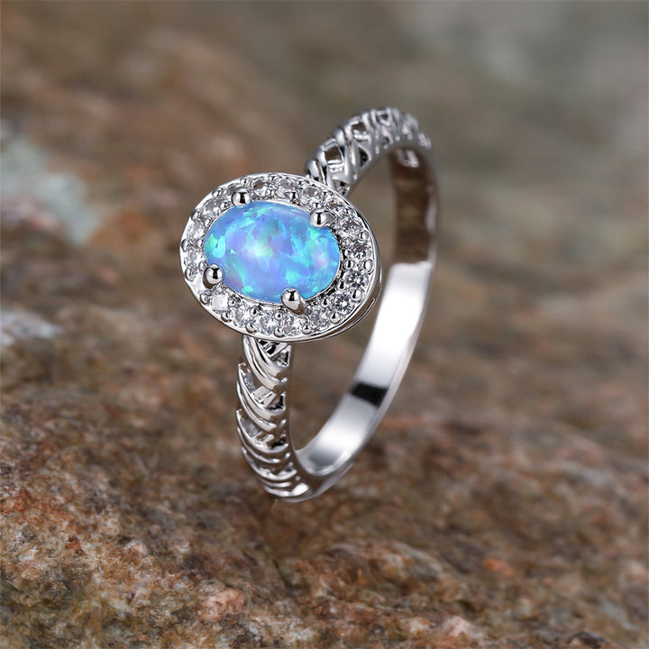 Anillo con diseño de cuerda trenzada con borde de ópalo ovalado de Olivenorma