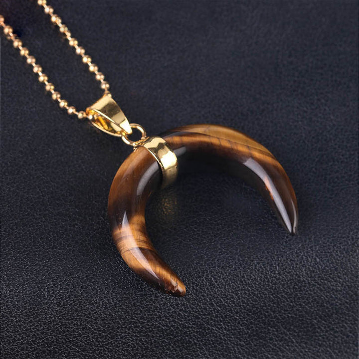 Collar de luna creciente con piedras preciosas de Olivenorma