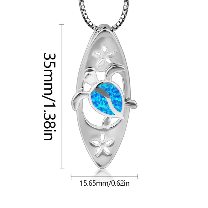 Collar con colgante de tortuga y tabla de surf con ópalo azul de Olivenorma