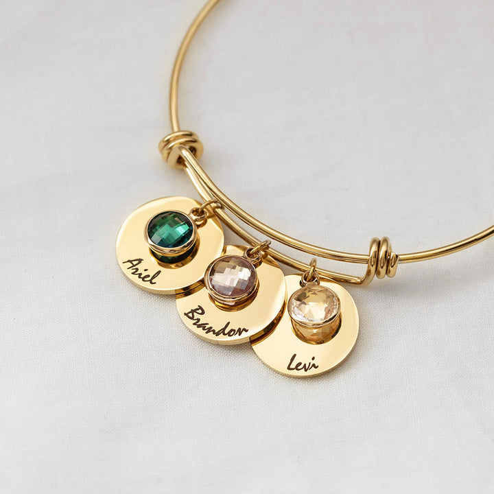 Pulsera retráctil con piedra natal grabada y disco personalizado de Olivenorma 