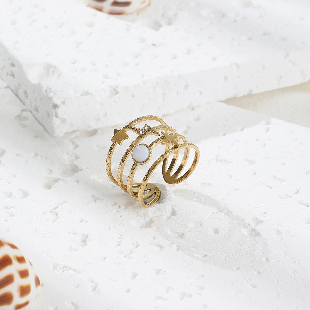 Anillo ajustable abierto de acero y titanio decorado con estrellas de Olivenorma