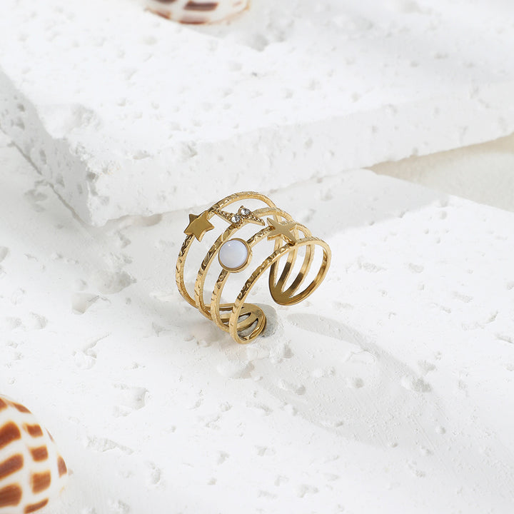 Anillo ajustable abierto de acero y titanio decorado con estrellas de Olivenorma