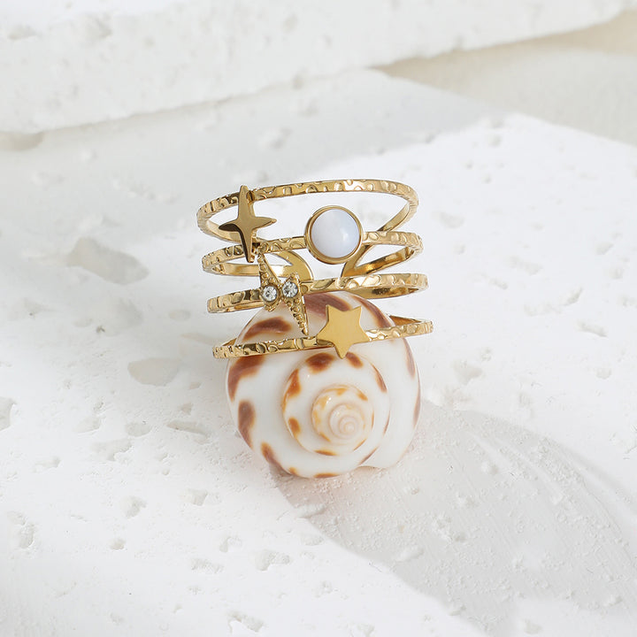 Anillo ajustable abierto de acero y titanio decorado con estrellas de Olivenorma