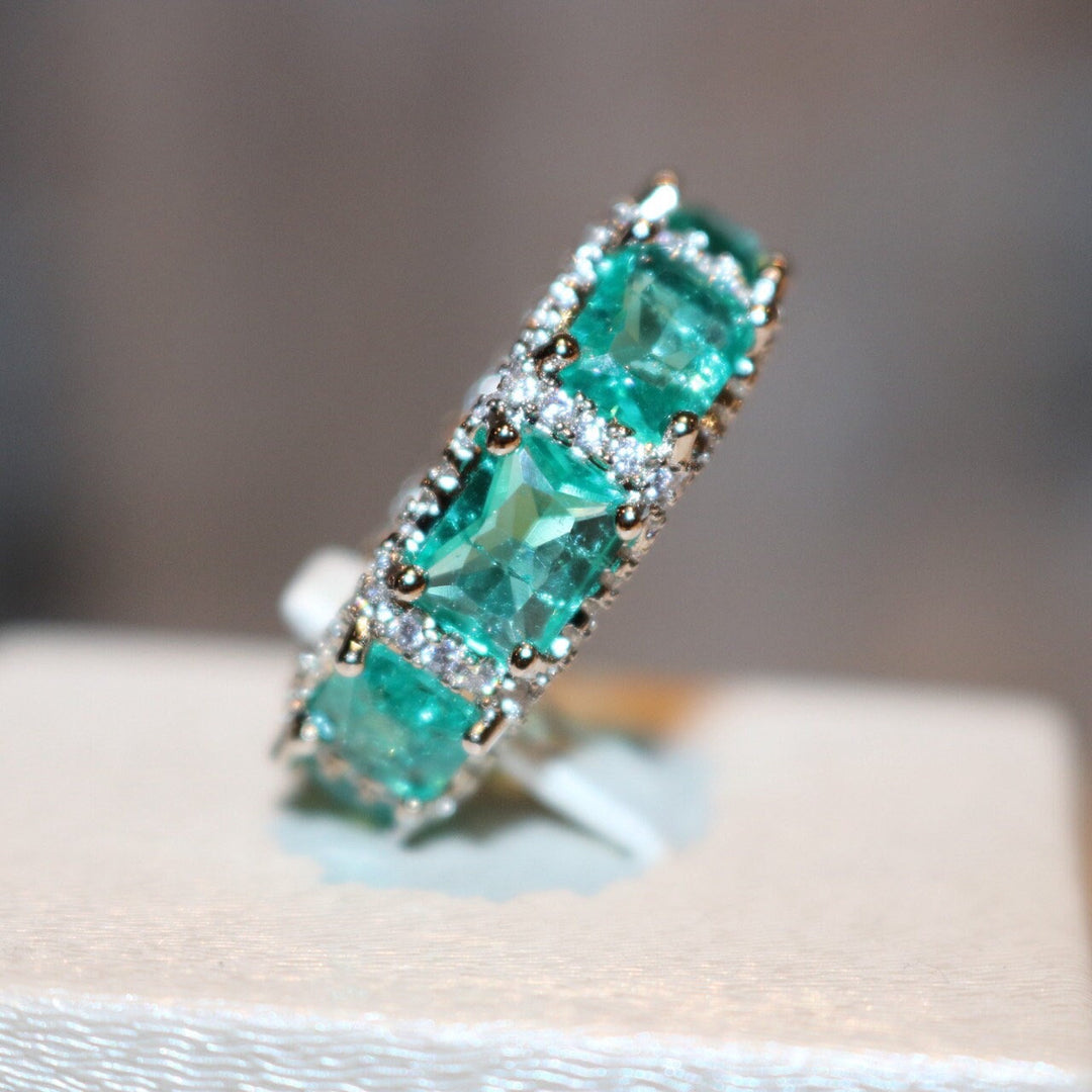 Anillo de eternidad completo con turmalina Paraiba azul océano de Olivenorma