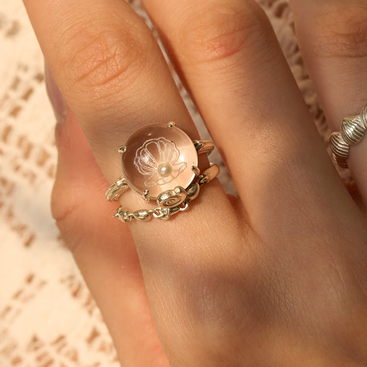 Anillo con diseño de concha de perla de cristal transparente de Olivenorma