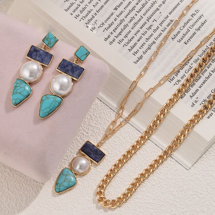 Conjunto de joyas con colgante de sodalita azul turquesa y perla irregular de Olivenorma