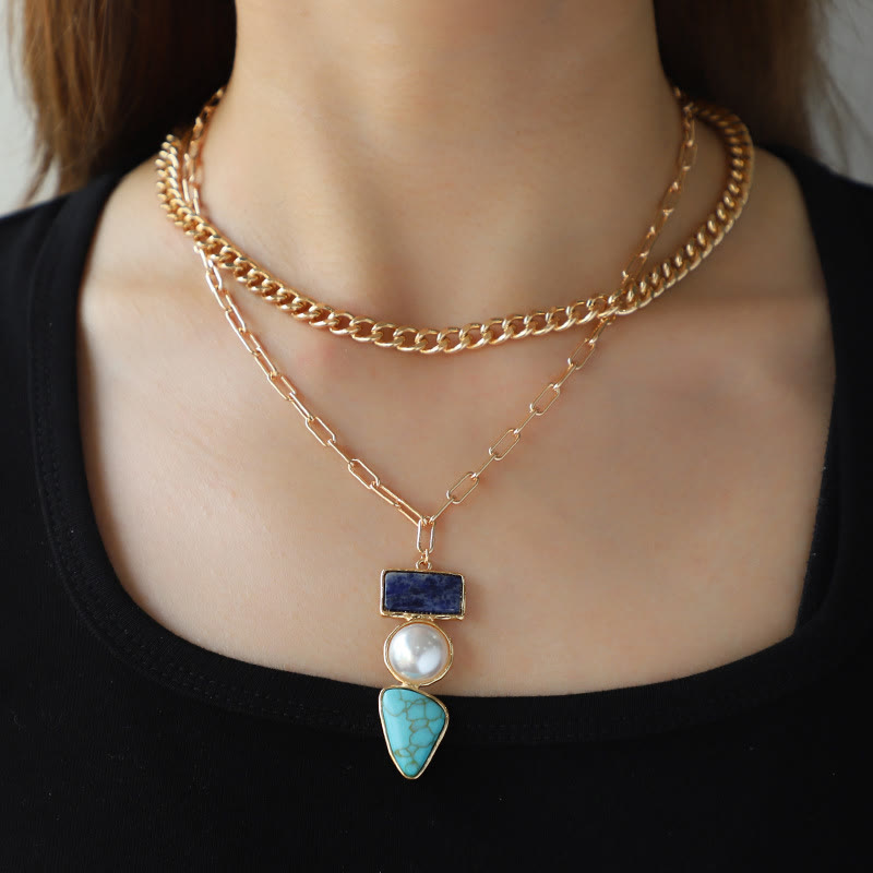 Conjunto de joyas con colgante de sodalita azul turquesa y perla irregular de Olivenorma