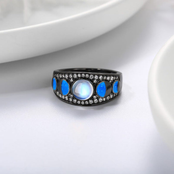 Anillo de plata con borde ancho y ópalo de piedra lunar de Olivenorma