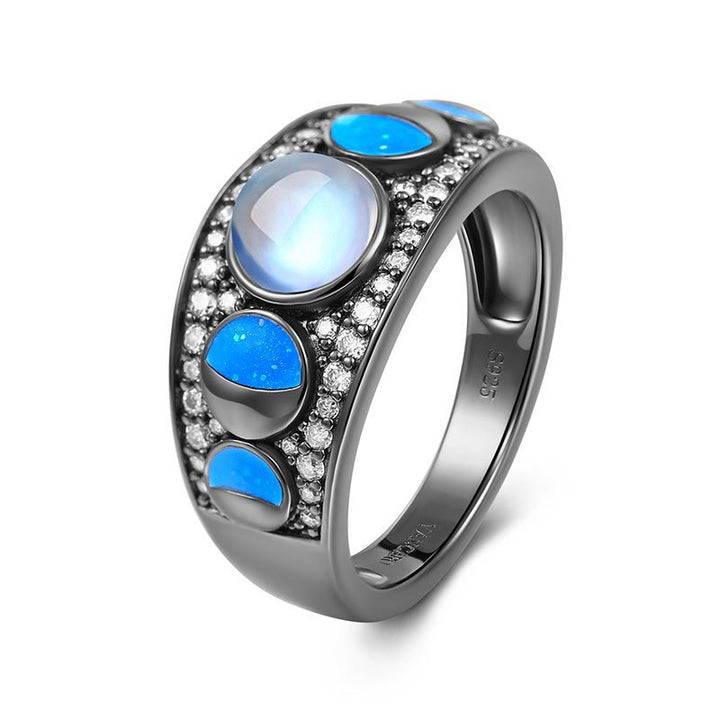 Anillo de plata con borde ancho y ópalo de piedra lunar de Olivenorma
