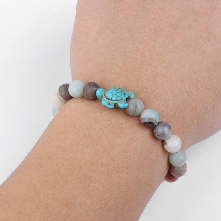 Olivenorma "Sense of Flow": pulsera sencilla con forma de tortuga y turquesa de piedra natural 