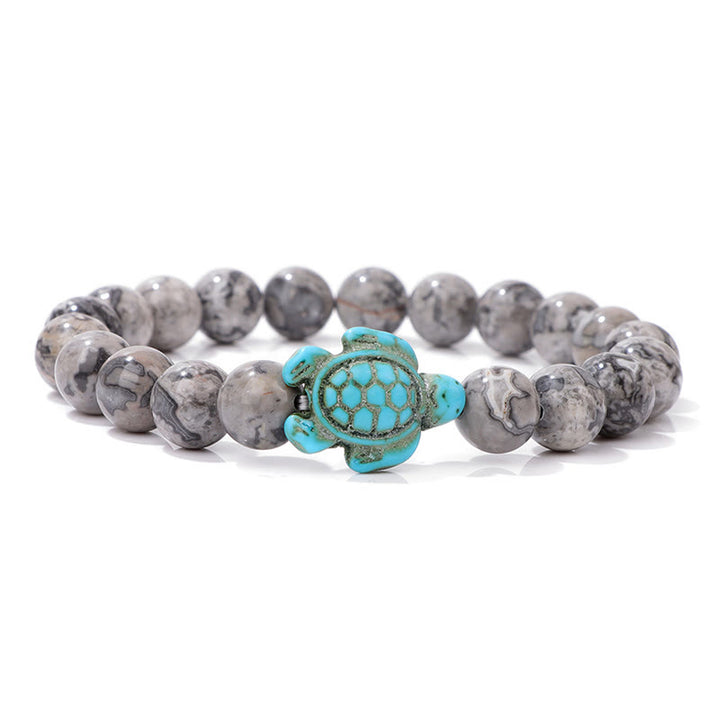 Olivenorma "Sense of Flow": pulsera sencilla con forma de tortuga y turquesa de piedra natural 