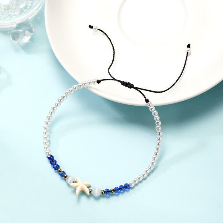 Tobillera tejida a mano con colgante de estrella de mar y perla de agua dulce de Olivenorma