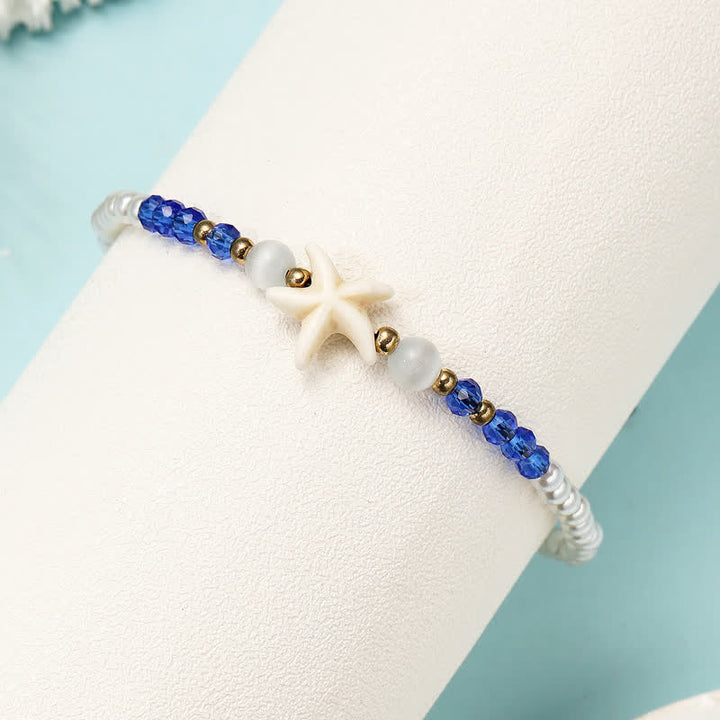 Tobillera tejida a mano con colgante de estrella de mar y perla de agua dulce de Olivenorma
