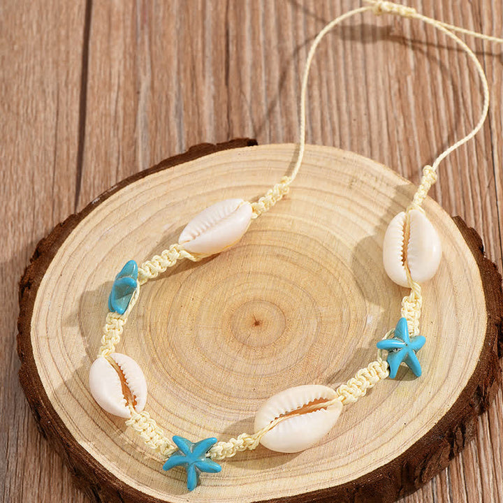 Tobillera trenzada con concha de tortuga y estrella de mar turquesa de Olivenorma