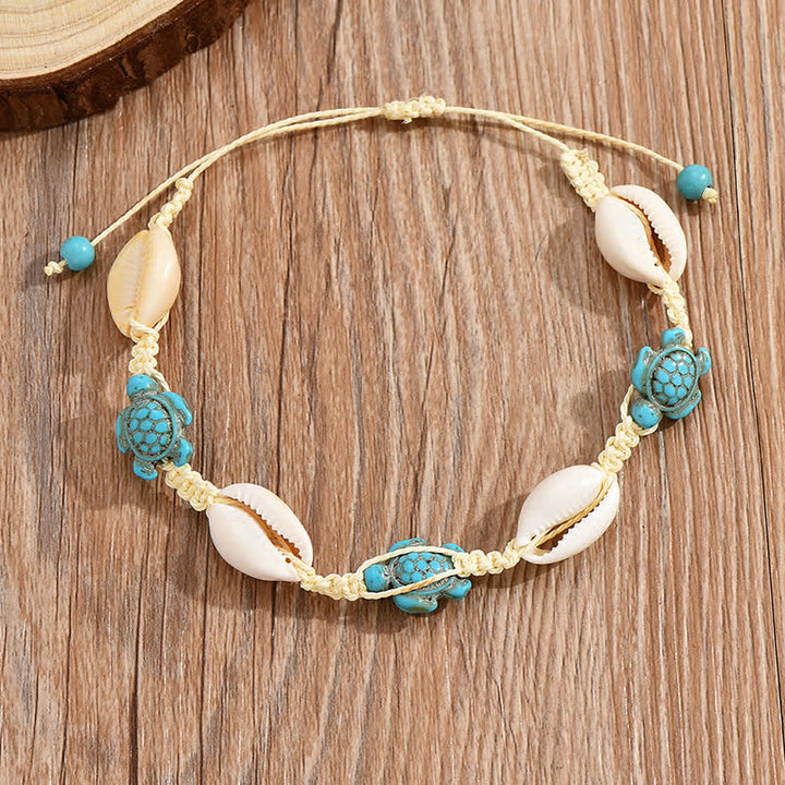 Tobillera trenzada con concha de tortuga y estrella de mar turquesa de Olivenorma