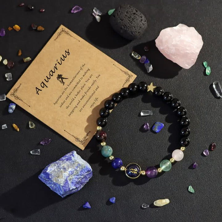 Pulsera con cuentas del zodiaco de piedra arenisca azul y ónix negro de Olivenorma 
