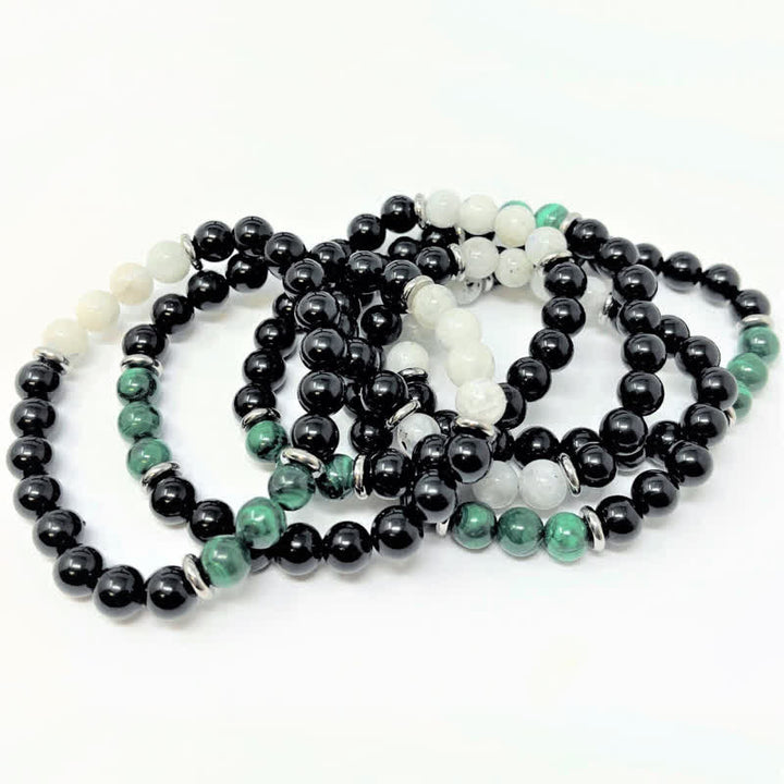 Pulsera de cuentas de piedra lunar, malaquita y obsidiana de Olivenorma 