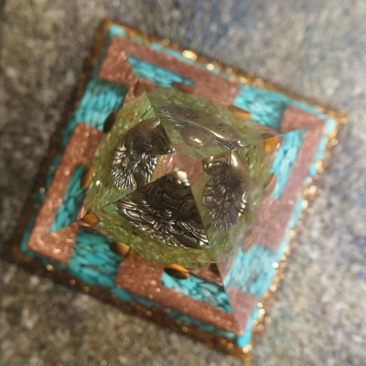 Pirámide de orgón de Buda con peridoto turquesa y ojo de tigre de Olivenorma