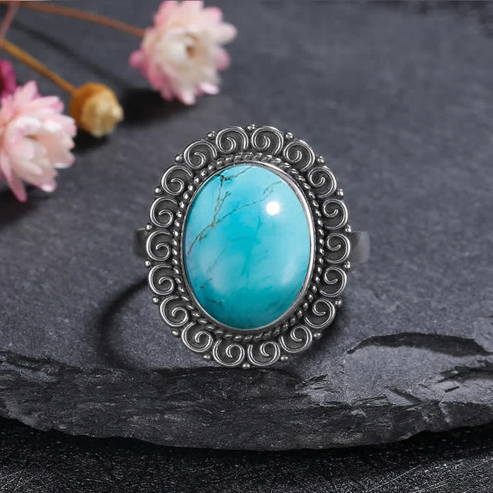 Anillo de piedra natural ovalada con forma de girasol tallado de Olivenorma