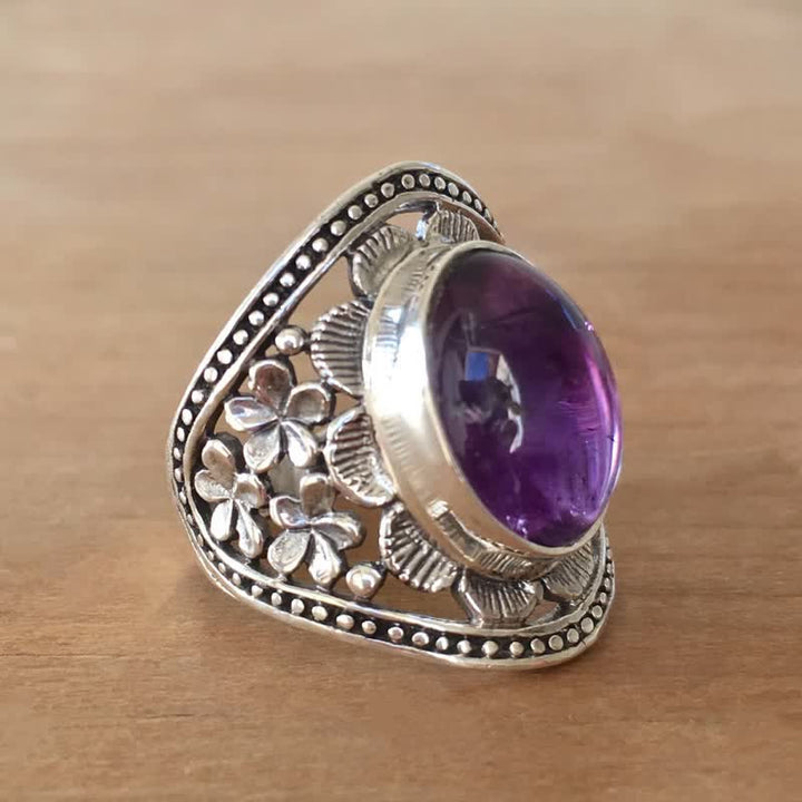 Anillo de flor hueca tallada con amatista ovalada natural de Olivenorma