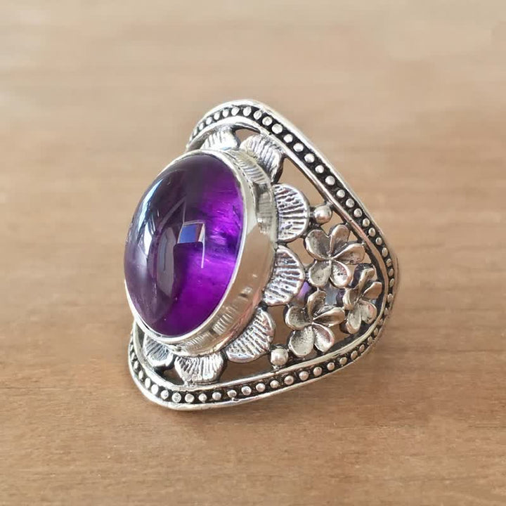 Anillo de flor hueca tallada con amatista ovalada natural de Olivenorma