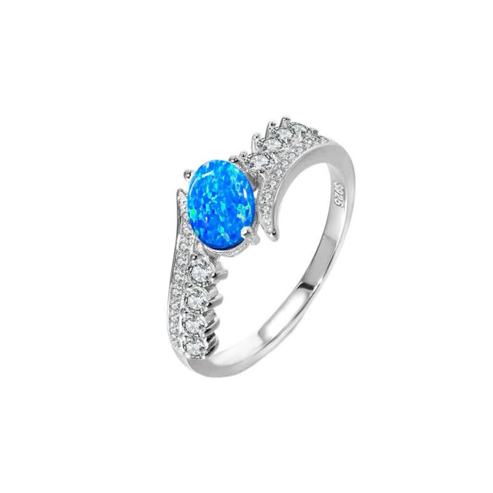 Anillo con alas envueltas en ópalo azul natural de Olivenorma