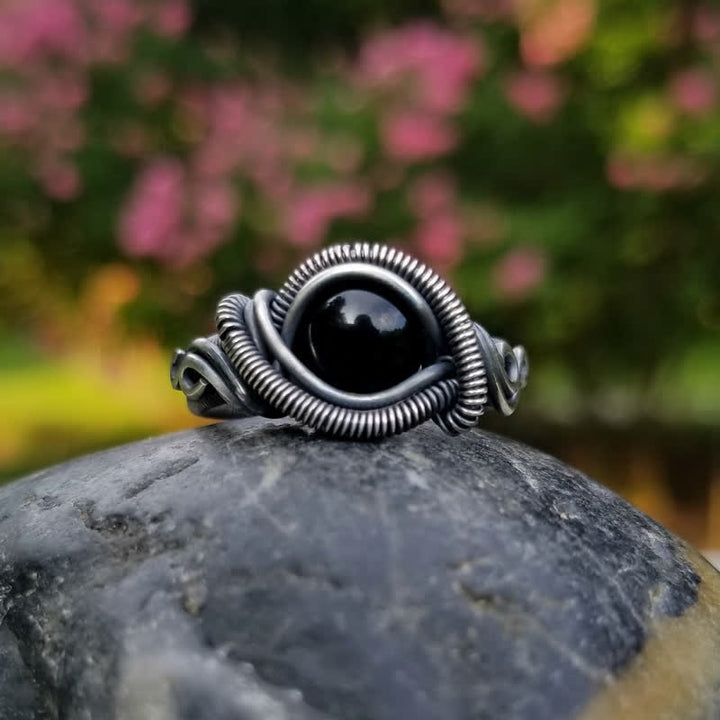 Anillo para hombre con nudo de ónix negro envuelto en alambre Olivenorma