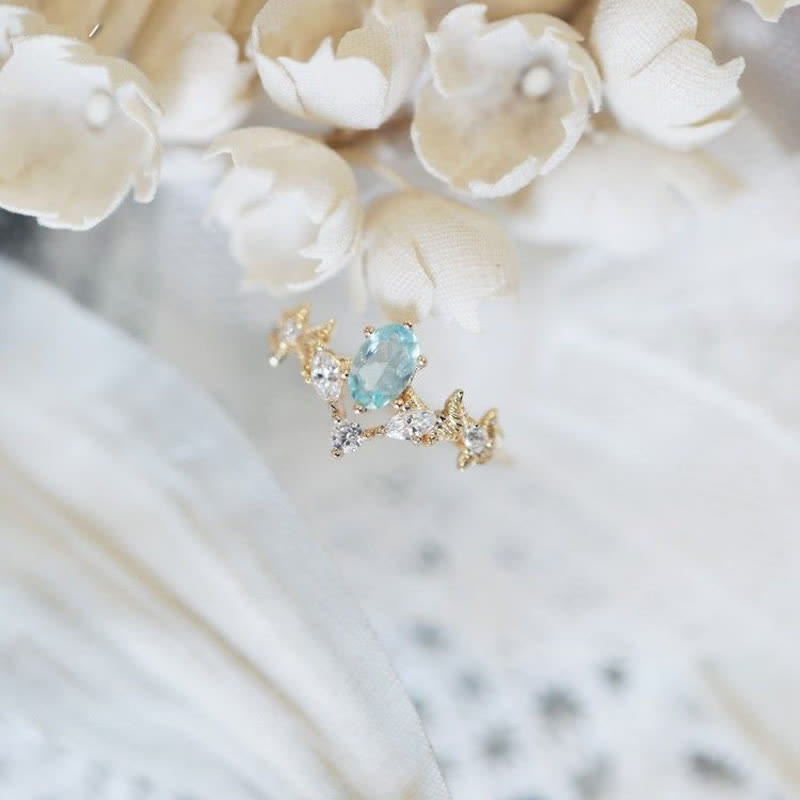 Anillo con forma de corona de circonita blanca y aguamarina de Olivenorma